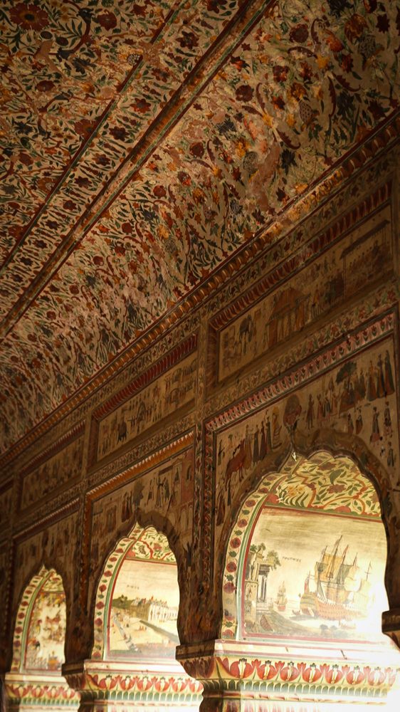 A hand-painted ceiling and frescoed walls